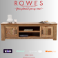 Wooden TV stand with decorative items on a gray background, featuring the brand 'Rowes'.