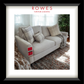 Gray sofa with patterned cushions on a textured rug, featuring Rowes Furniture & Bedding logo.