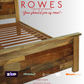 Wooden bed frame with 'Rowes Furniture and Bedding' advertisement on a white background