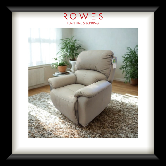 Beige recliner chair in a room with plants and sunlight, featuring 'Rowes Furniture & Bedding' logo.