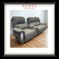 Gray recliner sofa on a wooden floor with 'Rowes Furniture & Bedding' branding.