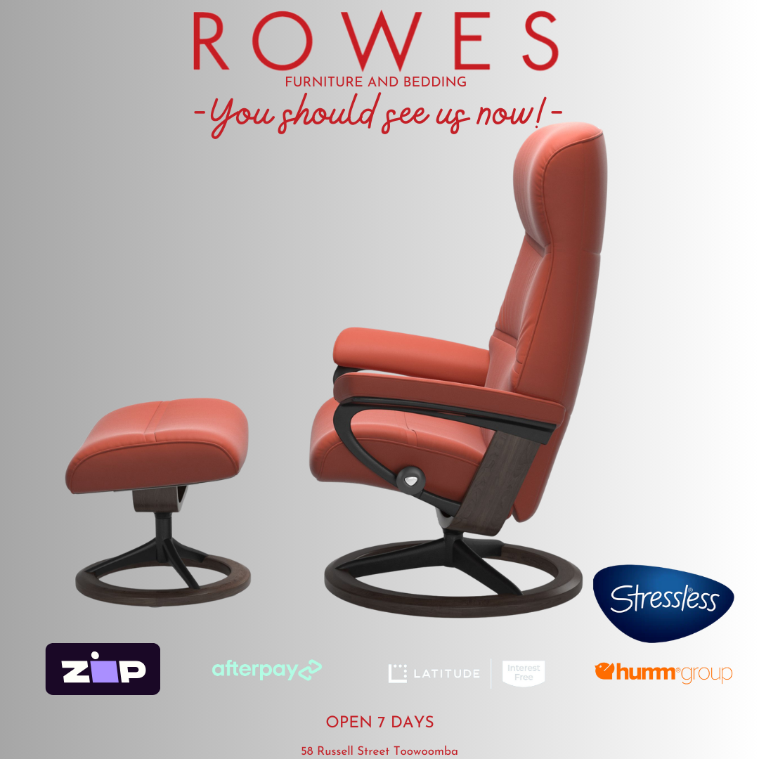 Red recliner chair with ottoman on a gray background, featuring the Stressless brand.