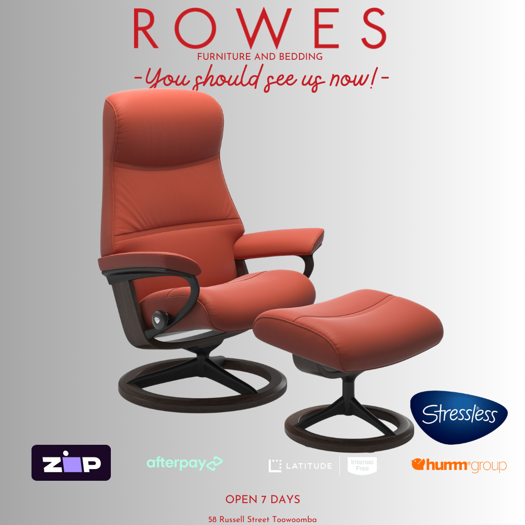 Red recliner chair with ottoman on a gray background, featuring the Stressless brand.
