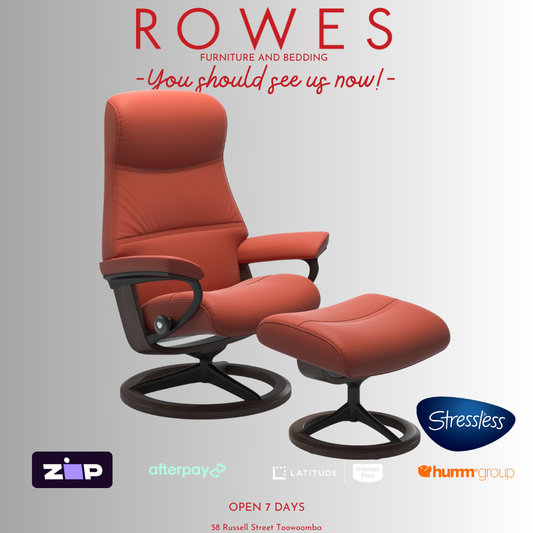 Red recliner chair with ottoman on a gray background, featuring the Stressless brand.