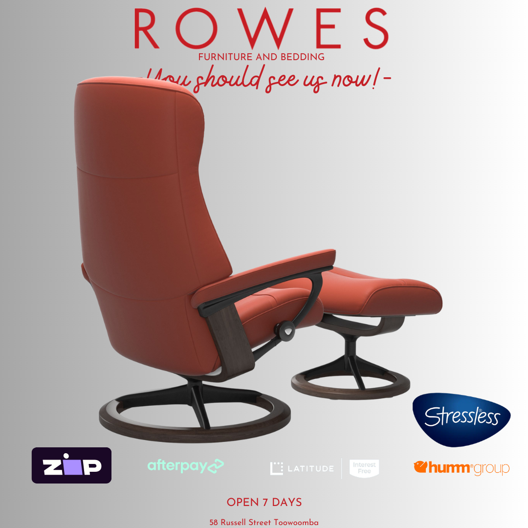 Red recliner chair with ottoman on a gray background, featuring the Stressless brand.