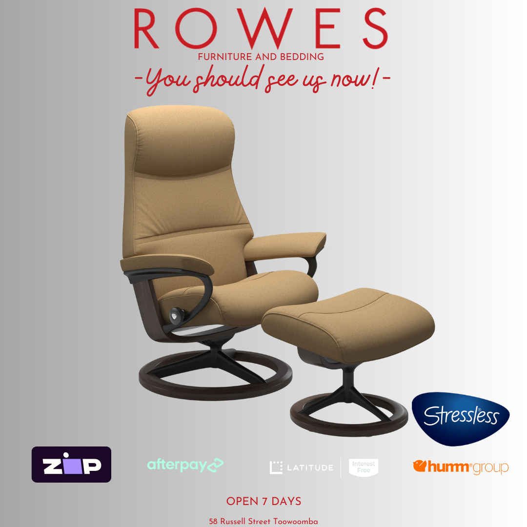 Beige recliner chair with ottoman on a gray background, featuring the Stressless brand.
