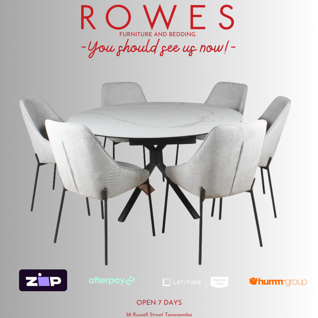 Dining table with chairs and 'Rowes Furniture and Bedding' advertisement on a gray background