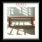 Wooden table in a room with sunlight filtering through windows, branded 'Rowes Furniture & Bedding'.