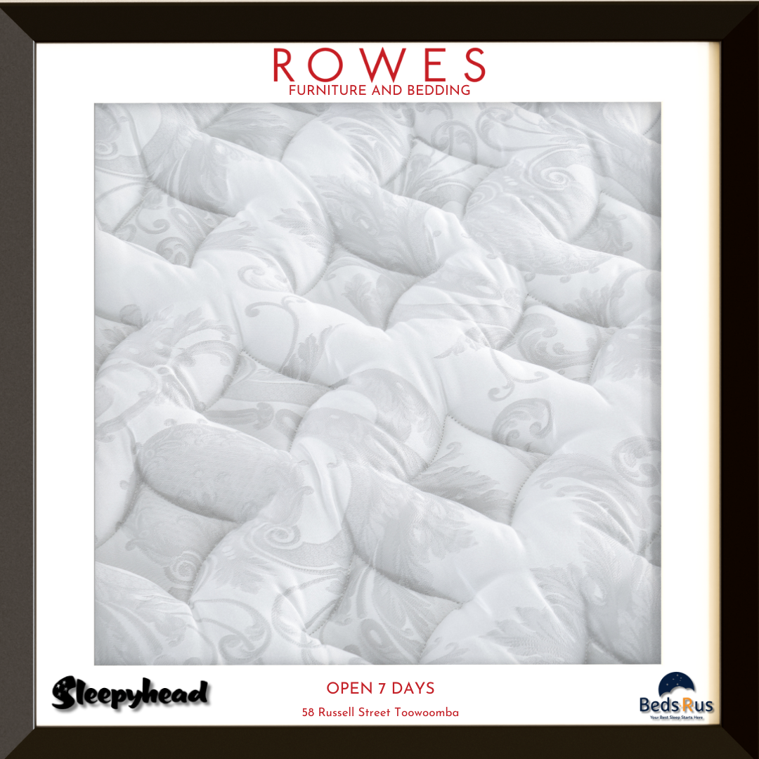 Close-up of quilted mattress with 'Rowes Furniture and Bedding' branding.