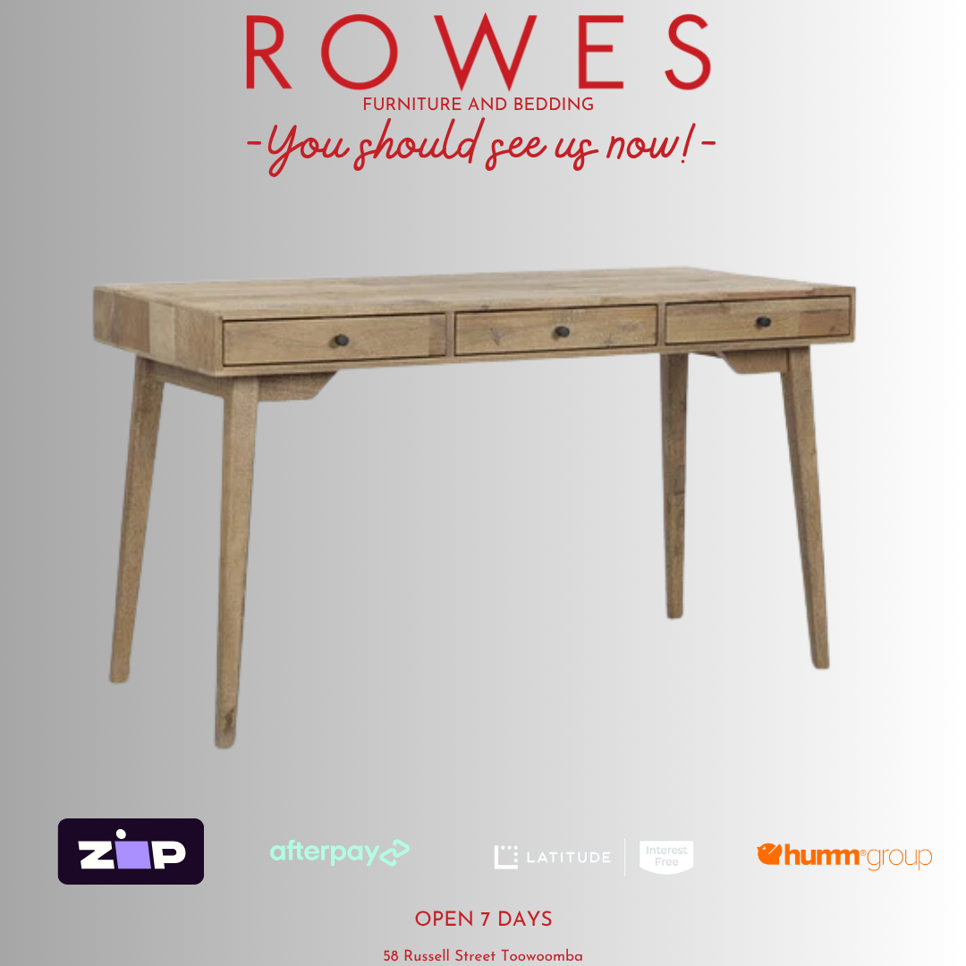 Wooden desk with 'Rowes Furniture and Bedding' advertisement on a gray background