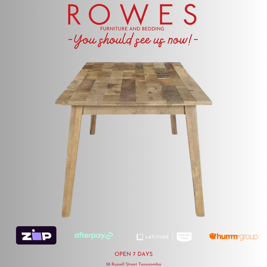 Wooden table with 'Rowes Furniture and Bedding' advertisement on a gray background