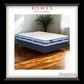 SleepMaker mattress in a room with wooden floor and window, featuring Rowes Furniture & Bedding logo.