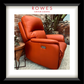 Orange recliner chair in an outdoor setting with 'Rowes Furniture & Bedding' branding.