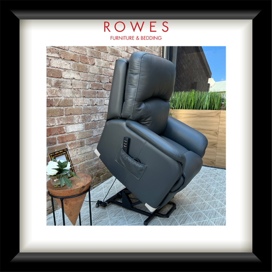 Gray recliner chair outdoors with 'Rowes Furniture & Bedding' branding.