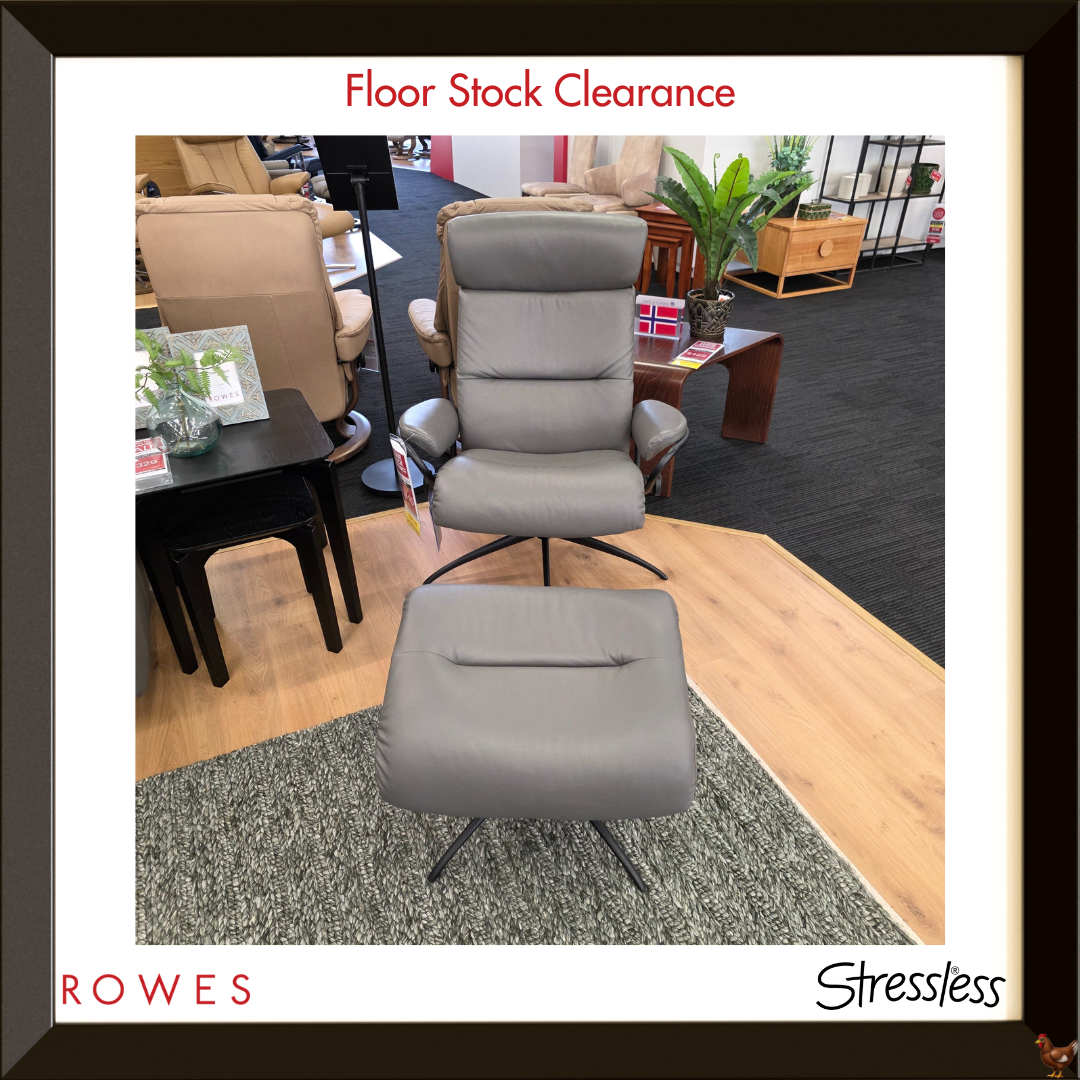 Gray chair with ottoman in a room setting, featuring 'Rowes' and 'Stressless' branding.
