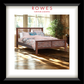 Wooden bed with pink bedding in a bright room, featuring Rowes Furniture & Bedding logo.