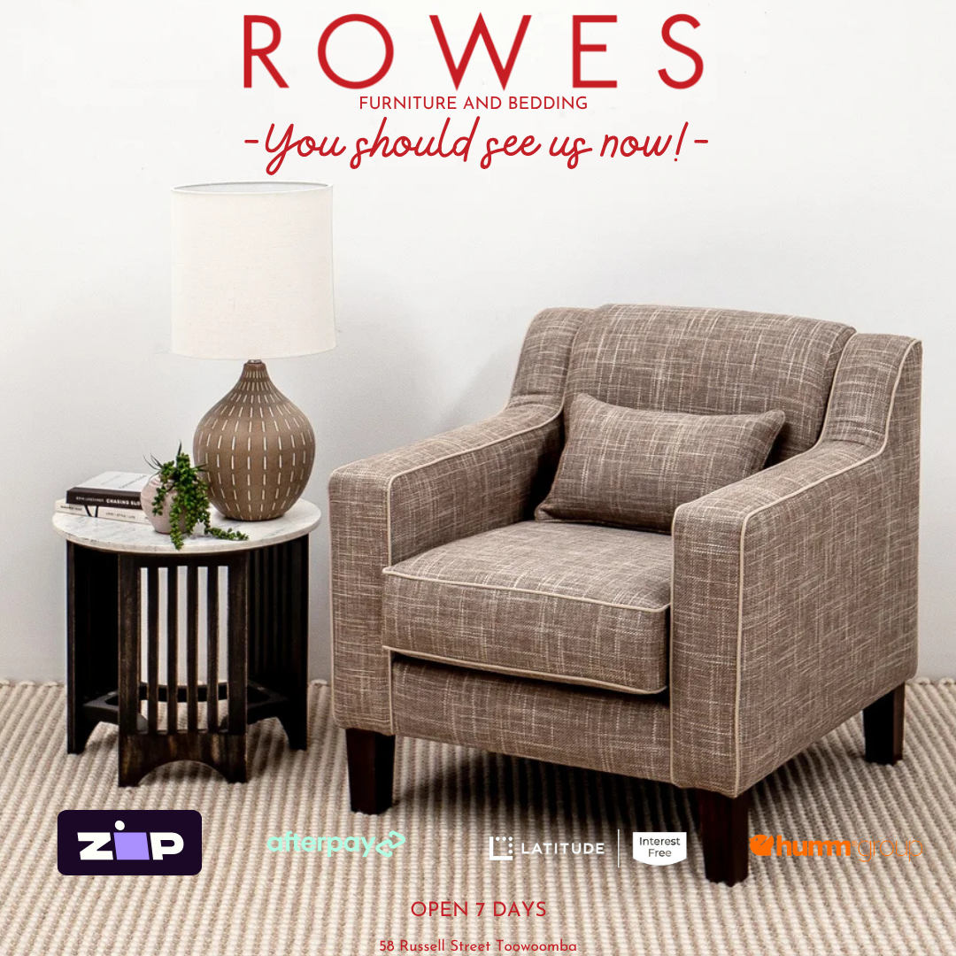 Gray armchair in a living room setting with 'Rowes Furniture and Bedding' text above.