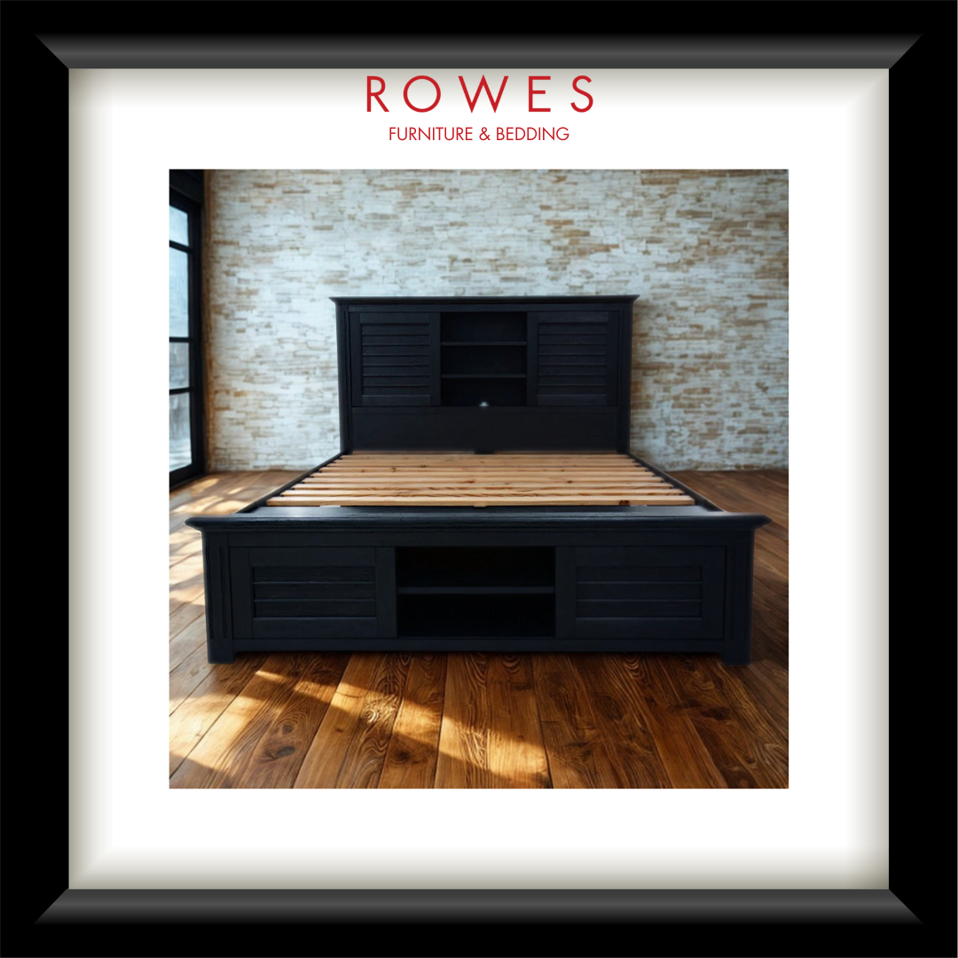Black bed frame with wooden slats against a brick wall, featuring 'Rowes Furniture & Bedding' logo.