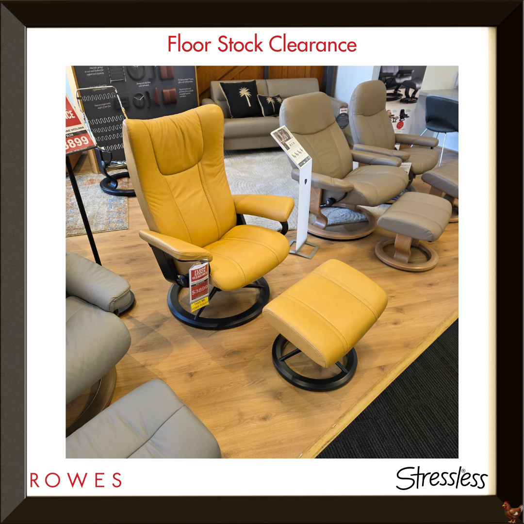 Yellow recliner chair with ottoman on a wooden floor, surrounded by other furniture pieces, with 'Floor Stock Clearance' text at the top.