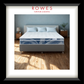 Bed with blue and white mattress in a bedroom setting, featuring Rowes Furniture & Bedding logo.