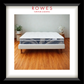 Mattress on a bed frame with 'Rowes Furniture & Bedding' branding.