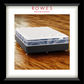 Mattress on a wooden floor with 'Rowes Furniture & Bedding' branding.