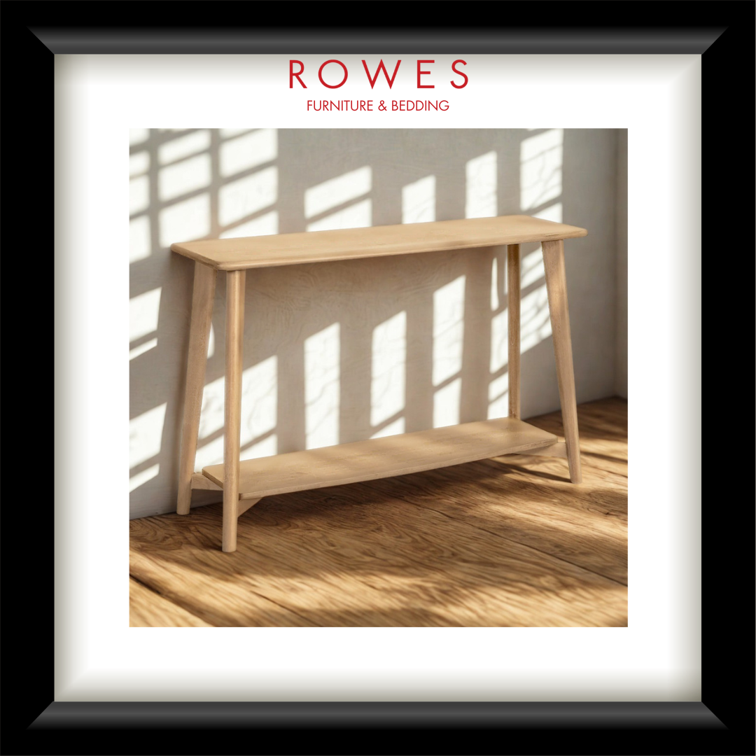 Wooden console table with sunlight casting shadows on a white wall, featuring 'Rowes Furniture & Bedding' logo.