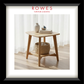 Wooden side table with decor items in a room with white curtains, featuring 'Rowes Furniture & Bedding' logo.
