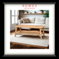 Wooden coffee table in a living room with 'Rowes Furniture & Bedding' branding.