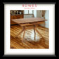 Wooden dining table on a wooden floor with 'Rowes Furniture & Bedding' branding.