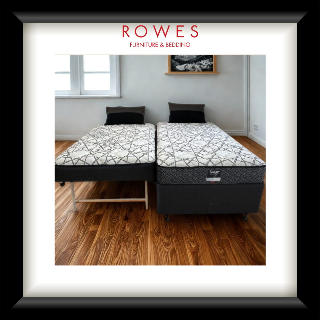 Split king mattress set on wooden floor with 'Rowes Furniture & Bedding' branding.